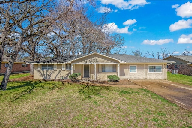 single story home featuring a front lawn, central AC, and driveway