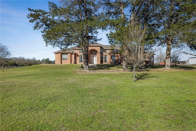 view of front of property with a front lawn