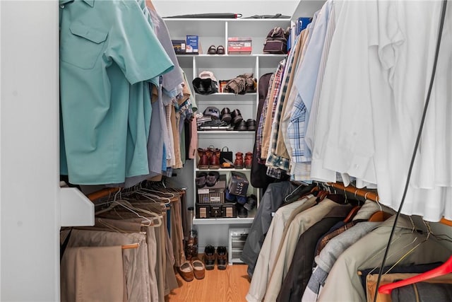 spacious closet with wood finished floors