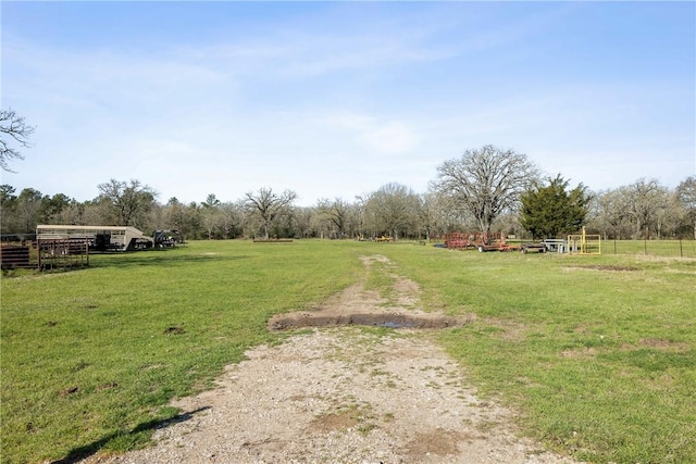 view of yard with a rural view