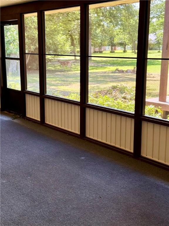 67 Fairway Dr, Hilltop Lakes, TX 77871 - unfurnished sunroom featuring plenty of natural light