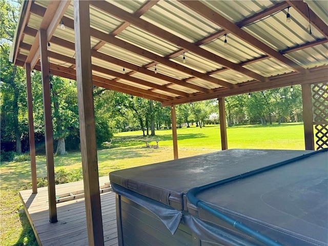 67 Fairway Dr, Hilltop Lakes, TX 77871 - deck with a hot tub, view of scattered trees, a lawn, and a carport