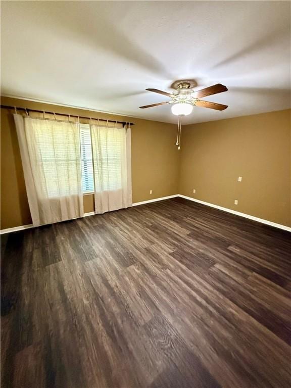 67 Fairway Dr, Hilltop Lakes, TX 77871 - unfurnished room with ceiling fan, baseboards, and dark wood-style flooring