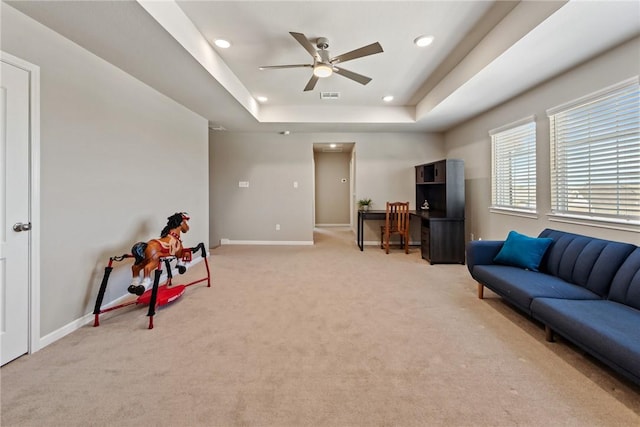 6317 Daytona Dr, College Station, TX 77845 - interior space featuring a tray ceiling, baseboards, ceiling fan, visible vents, and light carpet
