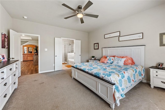 6317 Daytona Dr, College Station, TX 77845 - bedroom featuring light carpet, baseboards, connected bathroom, and ceiling fan