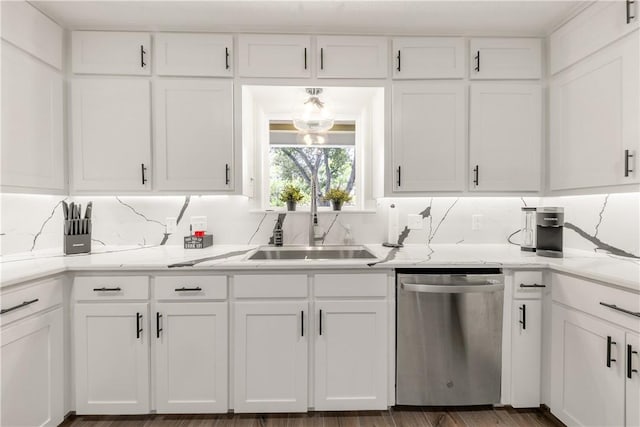 kitchen with dishwasher, decorative backsplash, white cabinetry, and sink