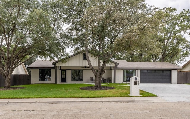 view of front of property with a front lawn and a garage