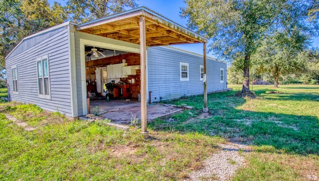 view of property exterior with a yard