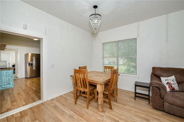 202 S Broadway St, Caldwell, TX 77836 - dining space featuring light wood-style floors and a chandelier