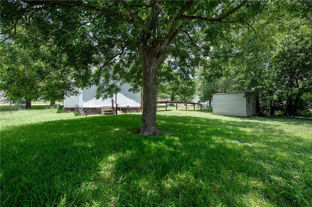 202 S Broadway St, Caldwell, TX 77836 - view of grassy yard featuring a shed