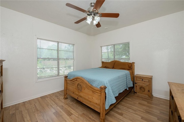 202 S Broadway St, Caldwell, TX 77836 - bedroom featuring light wood-style flooring and a ceiling fan