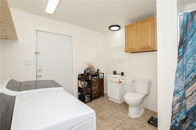 202 S Broadway St, Caldwell, TX 77836 - bathroom with tile patterned floors, vanity, a shower with curtain, and washing machine and clothes dryer