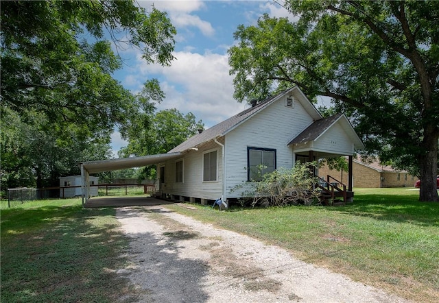 202 S Broadway St, Caldwell, TX 77836 - view of front facade with dirt driveway and a carport
