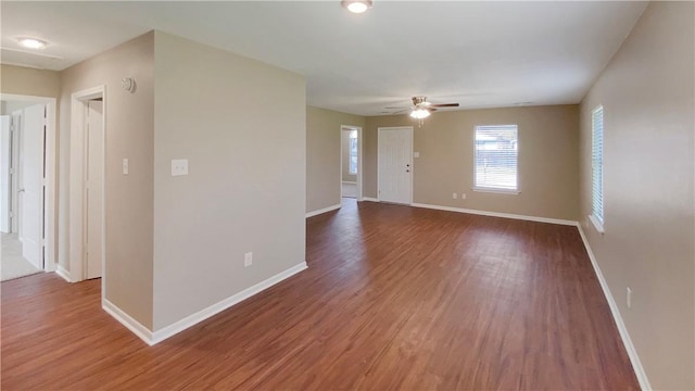 unfurnished room featuring hardwood / wood-style floors and ceiling fan