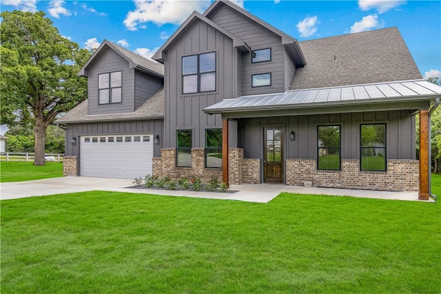 13291 Hopes Creek Rd, College Station, TX 77845 - view of front of home featuring board and batten siding, concrete driveway, roof with shingles, and brick siding