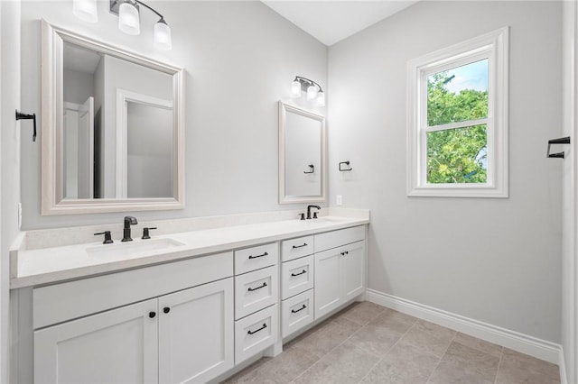 13291 Hopes Creek Rd, College Station, TX 77845 - bathroom with baseboards and double vanity