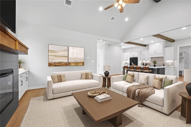 13291 Hopes Creek Rd, College Station, TX 77845 - living room with a ceiling fan, light wood finished floors, high vaulted ceiling, recessed lighting, and baseboards