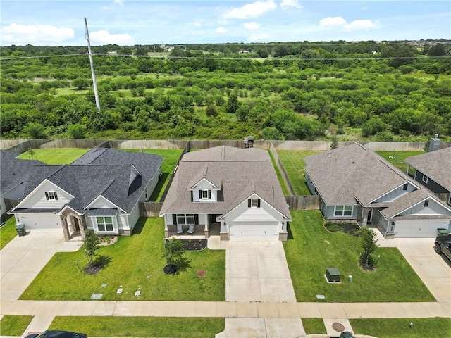 3448 Pointe Du Hoc Dr, Bryan, TX 77808 - view of subject property featuring a forest