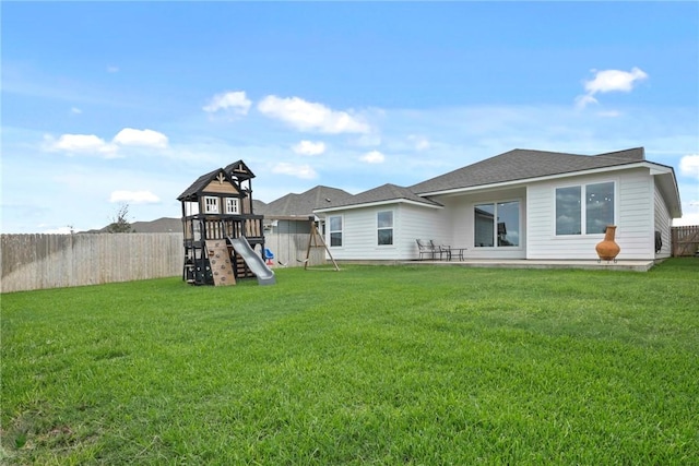 3448 Pointe Du Hoc Dr, Bryan, TX 77808 - back of house featuring a playground