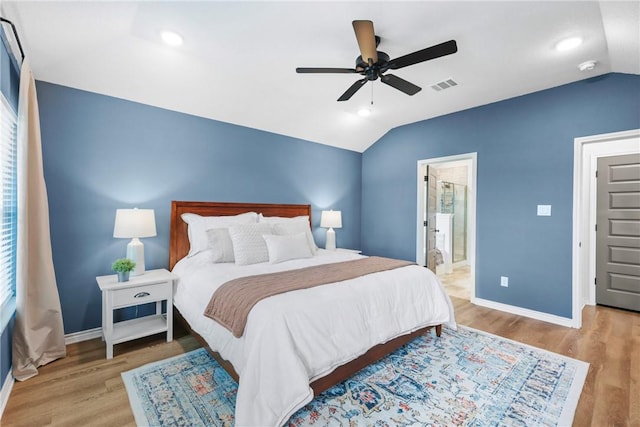 3448 Pointe Du Hoc Dr, Bryan, TX 77808 - bedroom with lofted ceiling, wood finished floors, ceiling fan, ensuite bath, and recessed lighting