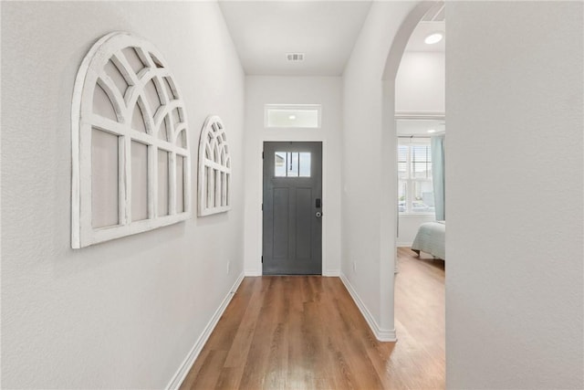 3448 Pointe Du Hoc Dr, Bryan, TX 77808 - entryway featuring wood finished floors and arched walkways