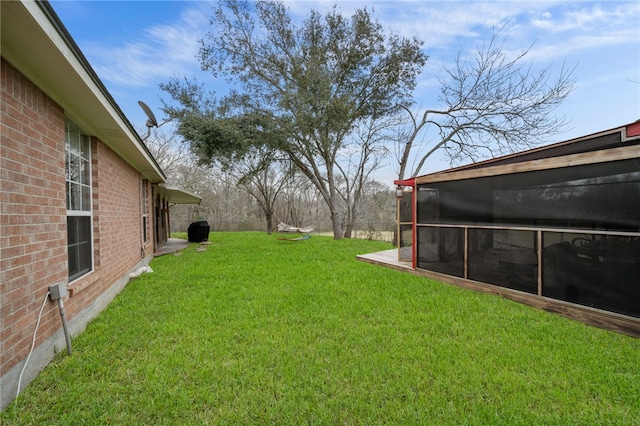 view of yard with a sunroom