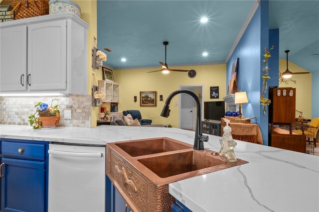 kitchen featuring blue cabinetry, white cabinetry, crown molding, open floor plan, and backsplash