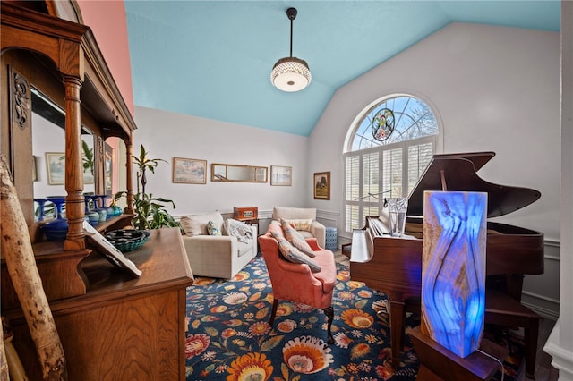 sitting room featuring lofted ceiling