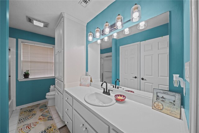 bathroom featuring tile patterned flooring, toilet, visible vents, and an enclosed shower