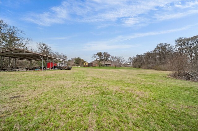 view of yard with a carport