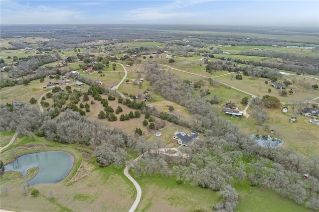 birds eye view of property with a water view and a rural view