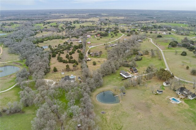 aerial view featuring a rural view and a water view