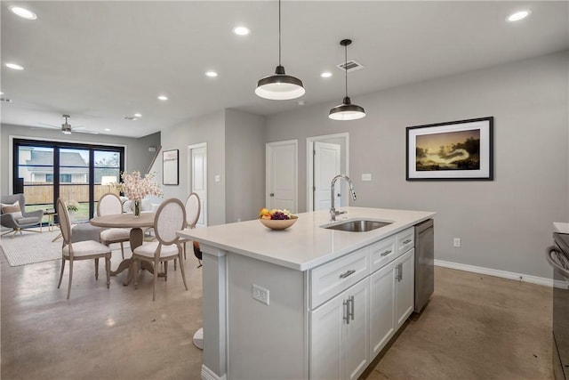 kitchen featuring sink, white cabinetry, hanging light fixtures, dishwasher, and an island with sink