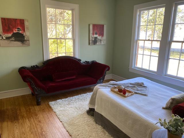 bedroom with wood-type flooring