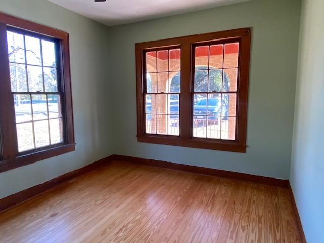 spare room featuring light hardwood / wood-style floors