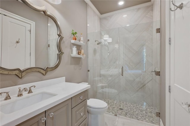 bathroom with vanity, toilet, and walk in shower