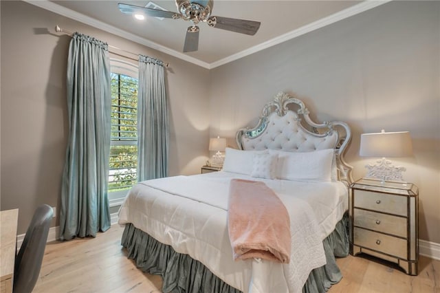 bedroom with light hardwood / wood-style floors, ceiling fan, and ornamental molding