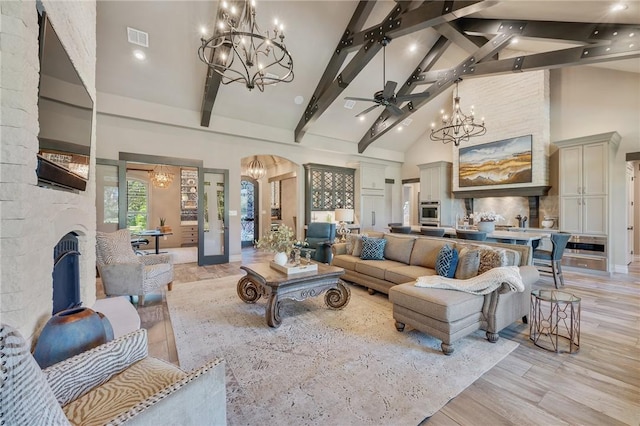 living room with ceiling fan, french doors, beamed ceiling, high vaulted ceiling, and light wood-type flooring