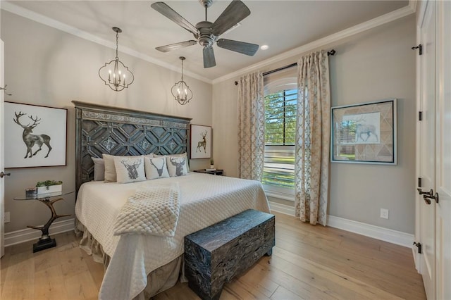 bedroom with crown molding, ceiling fan with notable chandelier, and light wood-type flooring