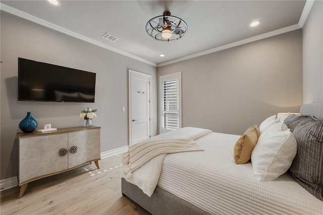 bedroom featuring light wood-type flooring and ornamental molding