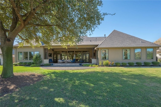 back of house featuring an outdoor living space, a yard, and a patio