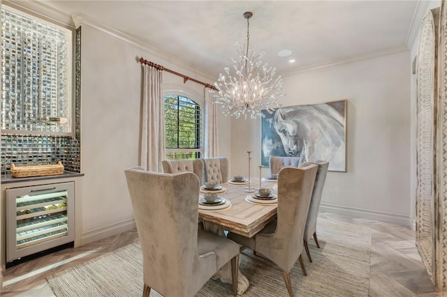 dining room featuring an inviting chandelier, crown molding, beverage cooler, and light parquet flooring