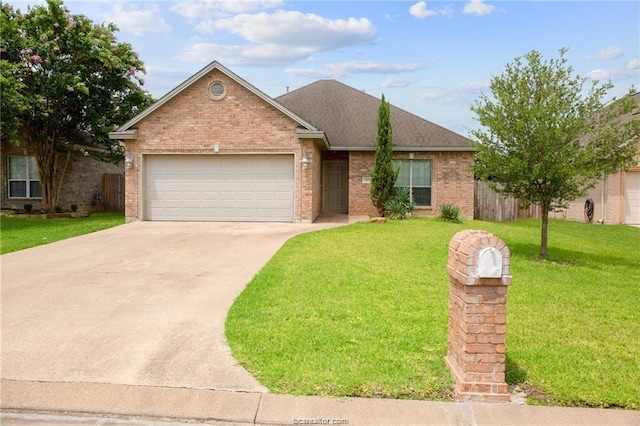 ranch-style home with brick siding, fence, concrete driveway, a front yard, and an attached garage