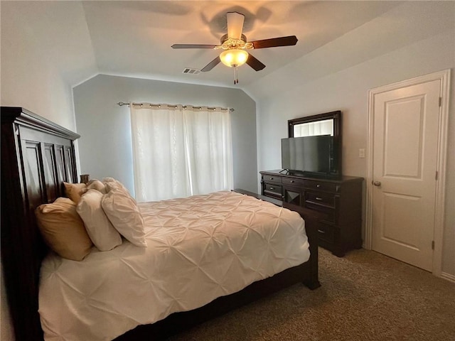 carpeted bedroom with lofted ceiling, ceiling fan, and visible vents