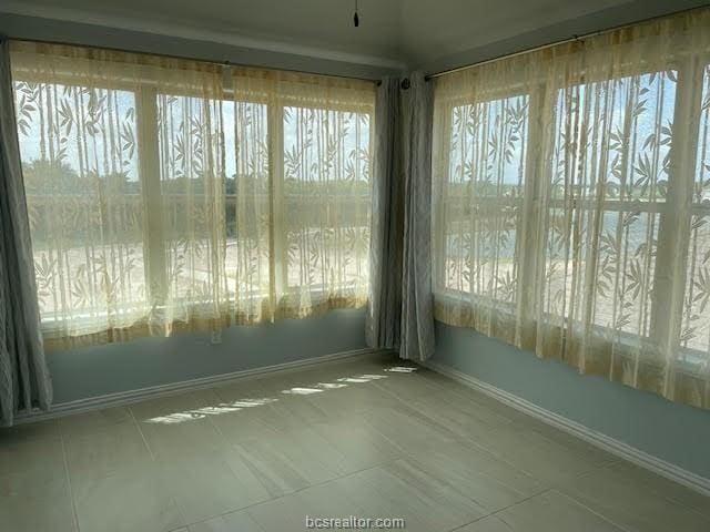 unfurnished sunroom with a healthy amount of sunlight