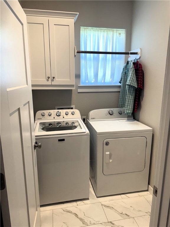 202 N Hearne St, Franklin, TX 77856 - laundry area featuring marble finish floor, independent washer and dryer, and cabinet space