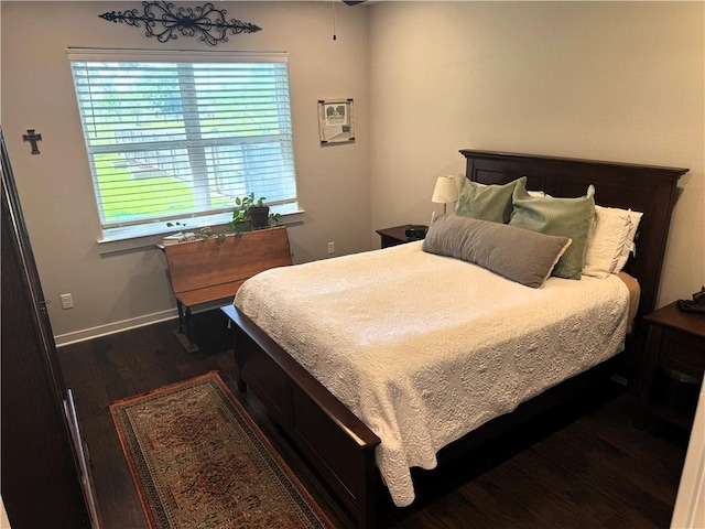 202 N Hearne St, Franklin, TX 77856 - bedroom featuring wood finished floors and baseboards