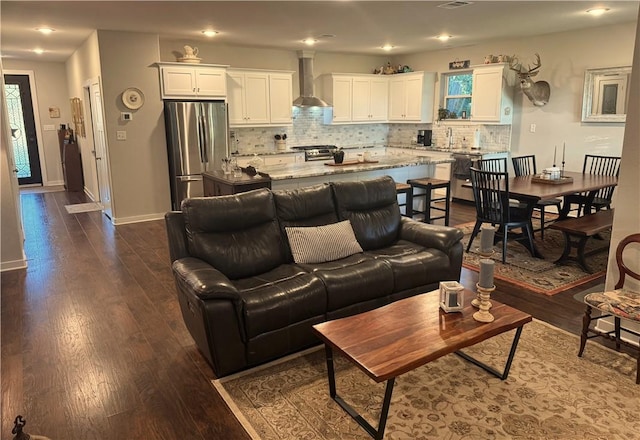 202 N Hearne St, Franklin, TX 77856 - living room with recessed lighting, baseboards, and dark wood-style floors