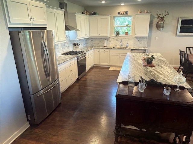 202 N Hearne St, Franklin, TX 77856 - kitchen with a sink, decorative backsplash, light stone counters, and appliances with stainless steel finishes