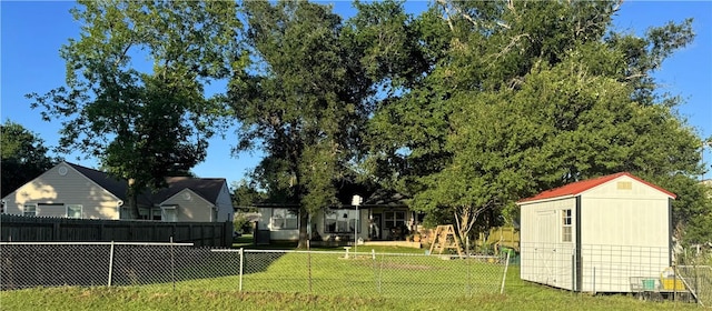 202 N Hearne St, Franklin, TX 77856 - view of yard with a fenced backyard, an outbuilding, and a storage shed